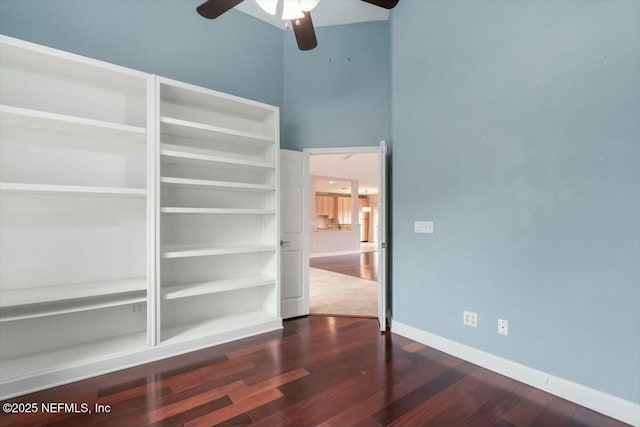 interior space with hardwood / wood-style floors and ceiling fan