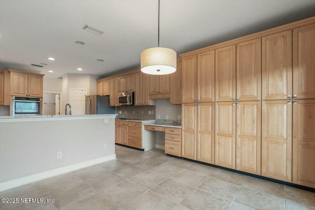 kitchen with decorative light fixtures, sink, stainless steel appliances, and tasteful backsplash