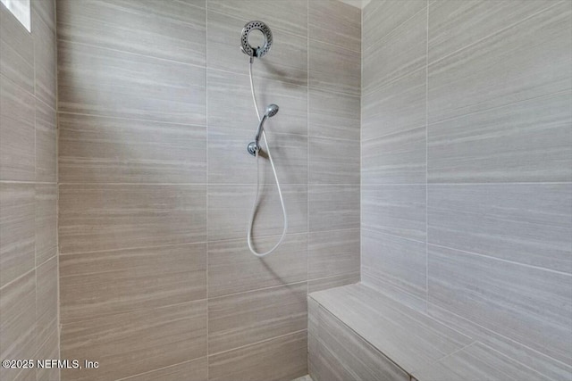 bathroom featuring a tile shower