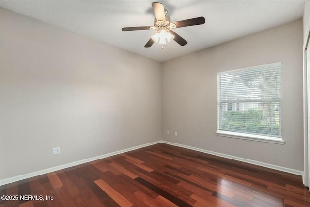 unfurnished room featuring ceiling fan and dark hardwood / wood-style flooring