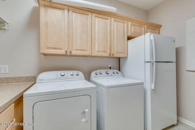 laundry area featuring light tile patterned floors