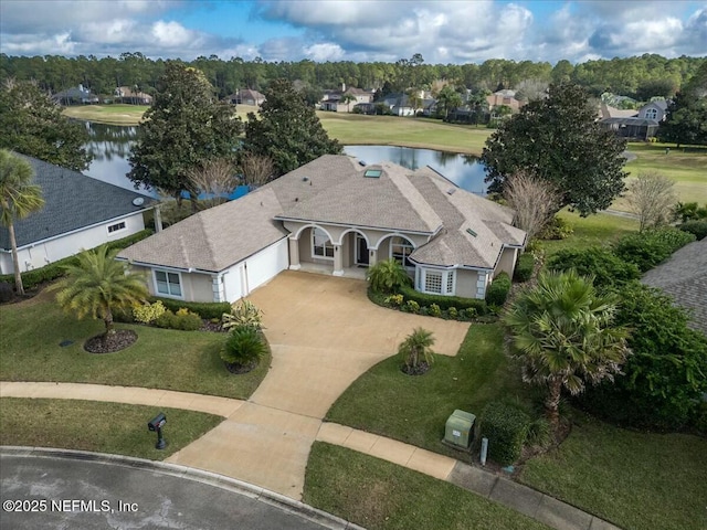 birds eye view of property with a water view