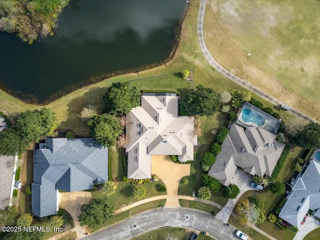 birds eye view of property featuring a water view