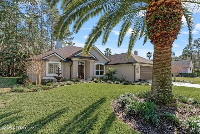 view of front of home with a garage and a front yard