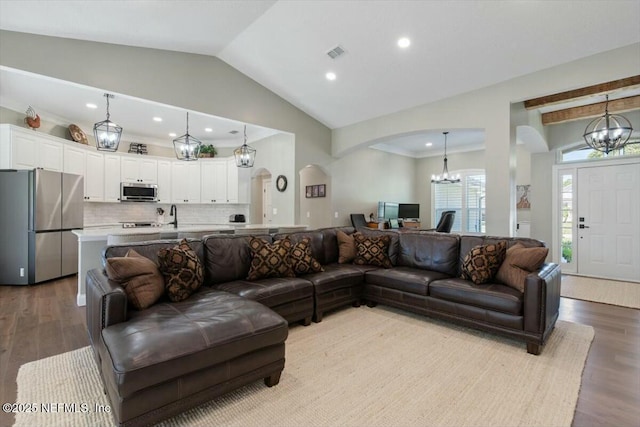 living room with lofted ceiling and light wood-type flooring