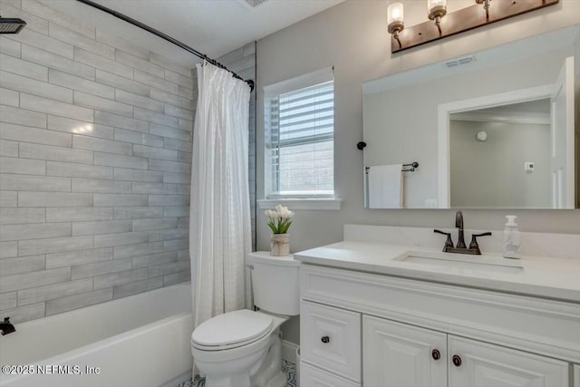 full bathroom with vanity, shower / bath combo, and toilet