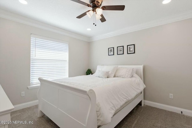 carpeted bedroom with ceiling fan and ornamental molding