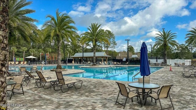 view of swimming pool featuring a patio area