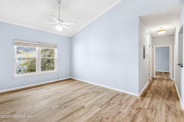 empty room with ceiling fan, light hardwood / wood-style floors, a textured ceiling, and ornamental molding