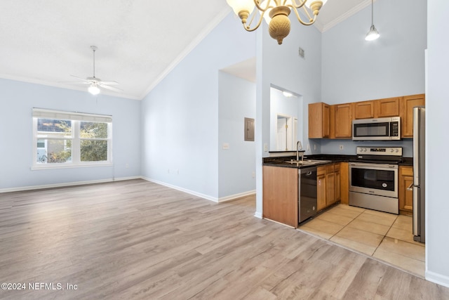 kitchen with appliances with stainless steel finishes, light wood-type flooring, ceiling fan with notable chandelier, crown molding, and pendant lighting