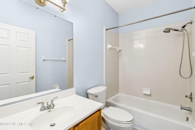 full bathroom with vanity, toilet, and tiled shower / bath combo