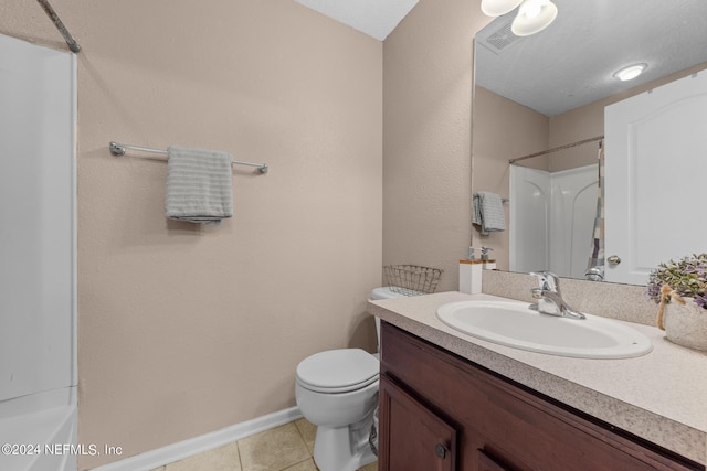 bathroom featuring tile patterned floors, vanity, and toilet