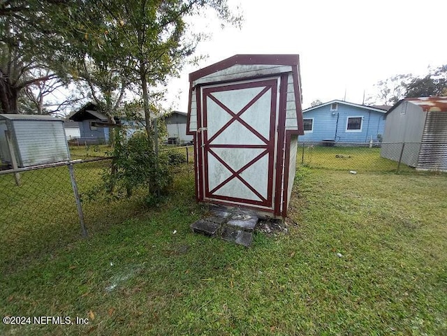 view of outdoor structure with a lawn