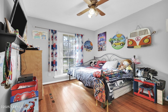 bedroom featuring hardwood / wood-style floors and ceiling fan