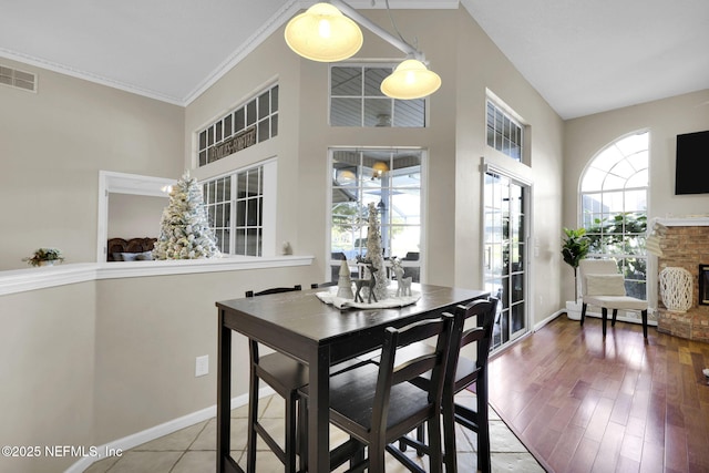 dining room with wood-type flooring and ornamental molding