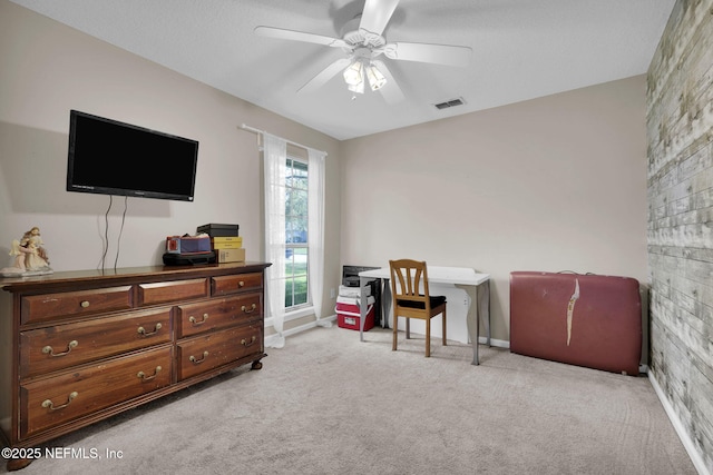 interior space with ceiling fan