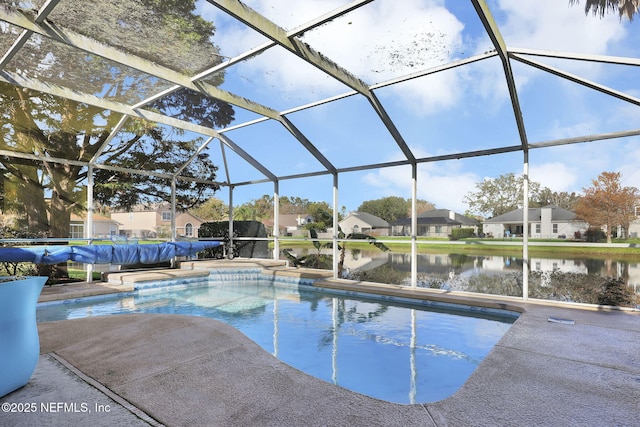 view of swimming pool featuring a lanai, a patio area, and a water view