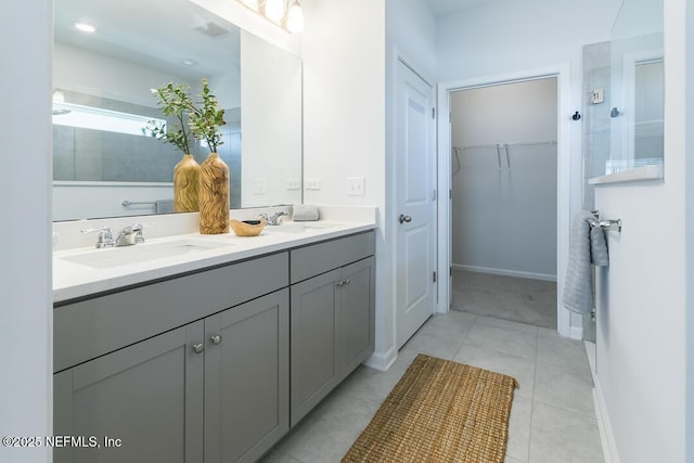 bathroom with tile patterned flooring and vanity