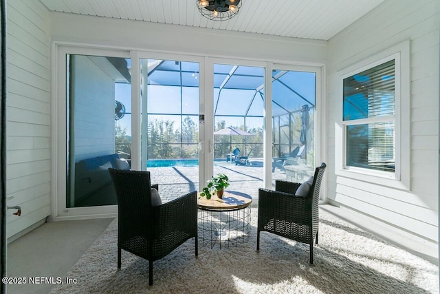 sunroom / solarium featuring a healthy amount of sunlight