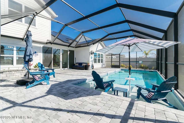 view of pool featuring a lanai and a patio area