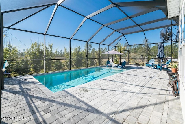 view of pool featuring a lanai and a patio