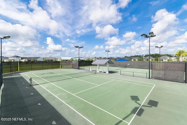 view of tennis court featuring basketball court