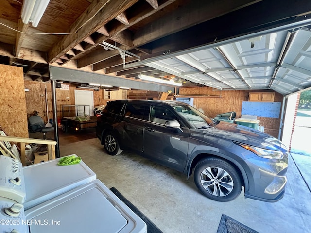 garage featuring wooden walls