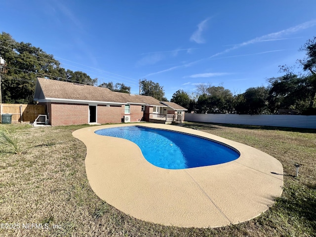 view of pool with a yard and a patio