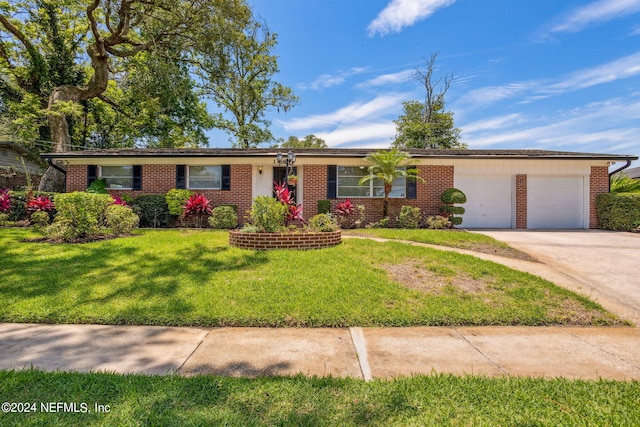 ranch-style house with a garage and a front lawn