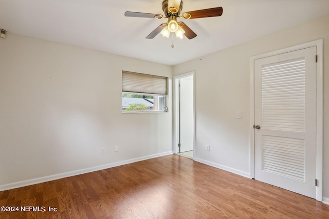 spare room featuring ceiling fan and light hardwood / wood-style floors