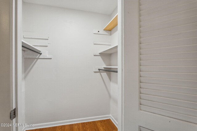 walk in closet featuring hardwood / wood-style flooring