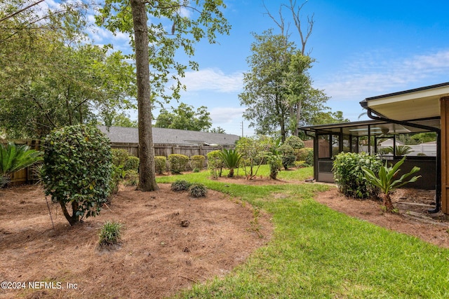 view of yard with a sunroom