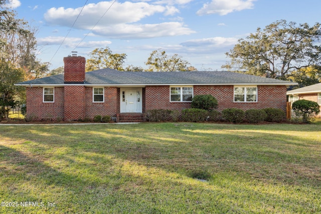 5140 Ortega Blvd, Jacksonville, FL 32210 - ranch-style house with a chimney, a front yard, brick siding, and roof with shingles