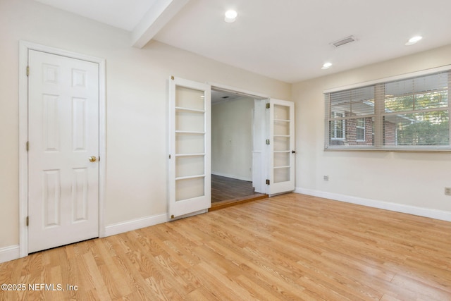 5140 Ortega Blvd, Jacksonville, FL 32210 - unfurnished bedroom with french doors, light wood-type flooring, recessed lighting, and beamed ceiling