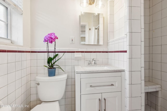 5140 Ortega Blvd, Jacksonville, FL 32210 - full bathroom with tile walls, vanity, and a wainscoted wall