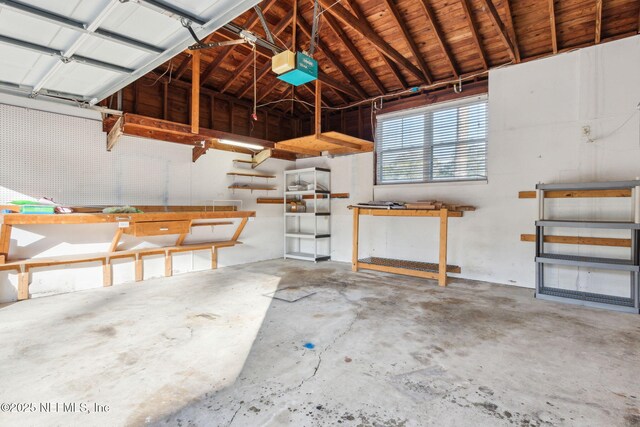 5140 Ortega Blvd, Jacksonville, FL 32210 - garage featuring a workshop area and a garage door opener