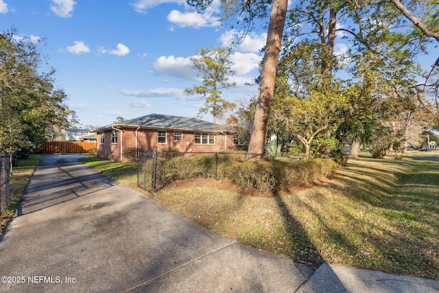 ranch-style home featuring a front yard