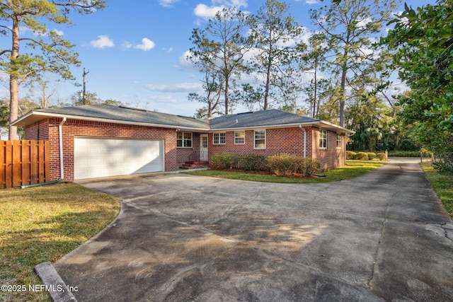 ranch-style home with a front lawn and a garage