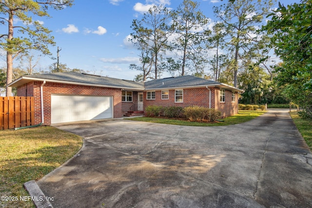 5140 Ortega Blvd, Jacksonville, FL 32210 - ranch-style home featuring concrete driveway, brick siding, and an attached garage