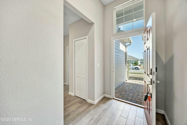 entryway with light hardwood / wood-style floors