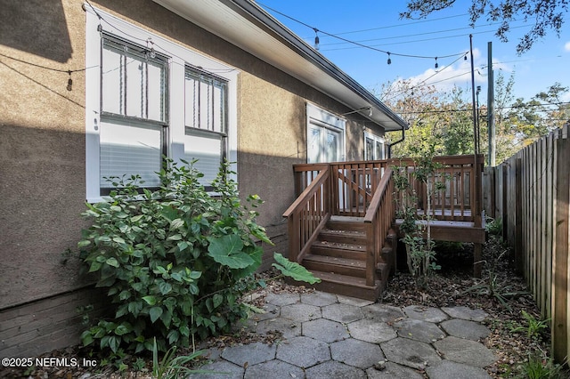 view of side of property featuring a deck