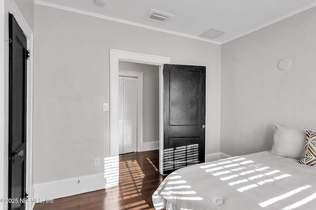 bedroom featuring dark hardwood / wood-style flooring