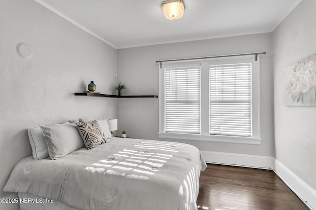 bedroom featuring dark hardwood / wood-style floors and crown molding