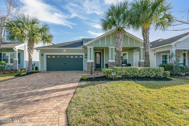 craftsman-style house with a front yard and a garage