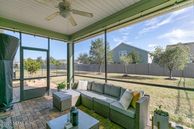 sunroom / solarium with ceiling fan