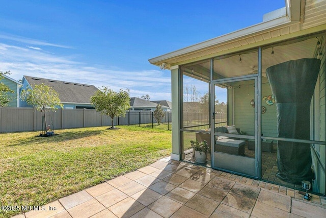 view of patio / terrace featuring a sunroom