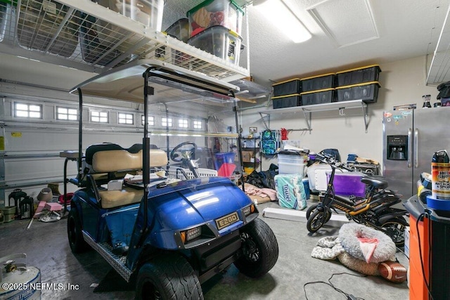 garage with stainless steel fridge