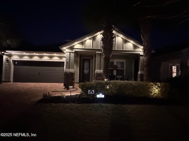 craftsman-style home with a garage