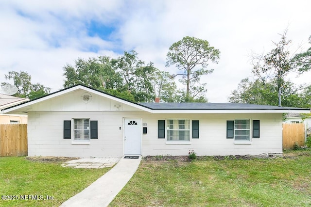 single story home featuring a front lawn