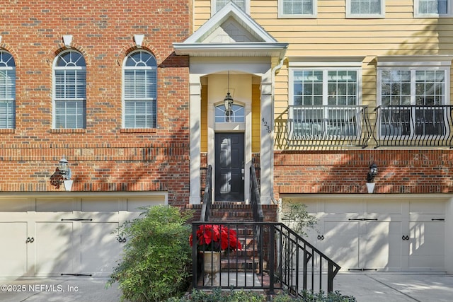 view of exterior entry with a garage